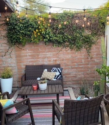 Private patio with room for furniture and grill. Furniture, rug and potted plants not included.