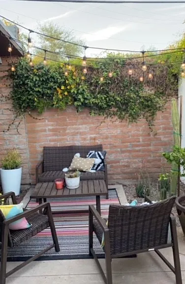 Private patio with room for furniture and grill. Furniture, rug and potted plants not included.