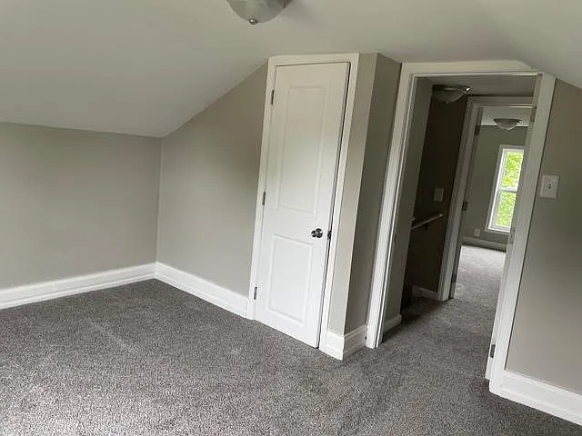Second bedroom upstairs with carpet and closet.