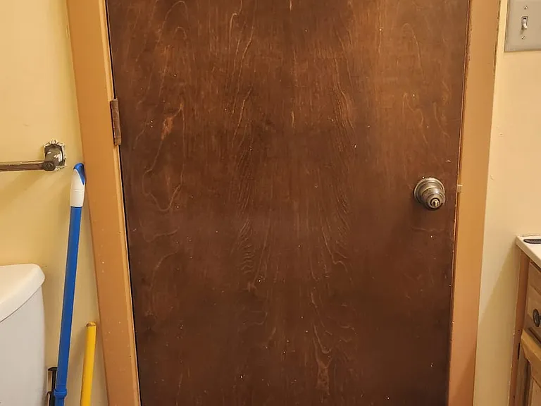 Shared bathroom with door closed