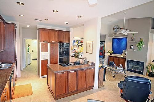 Beautiful kitchen opens to the den.