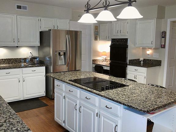 Kitchen with desk area and double ovens