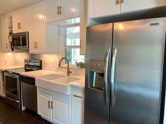 Newly remodeled kitchen with marble countertops