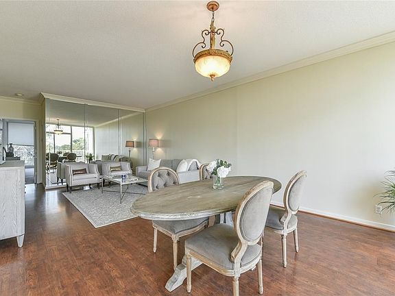 Wood floors enhance the living/dining area.