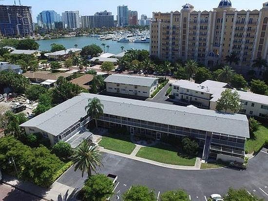 Front exterior. Marina Jacks and down town SRQ in background.