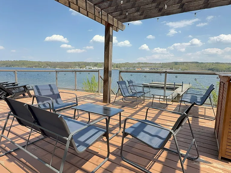Outdoor lounge with a bar at the third deck area by the dock