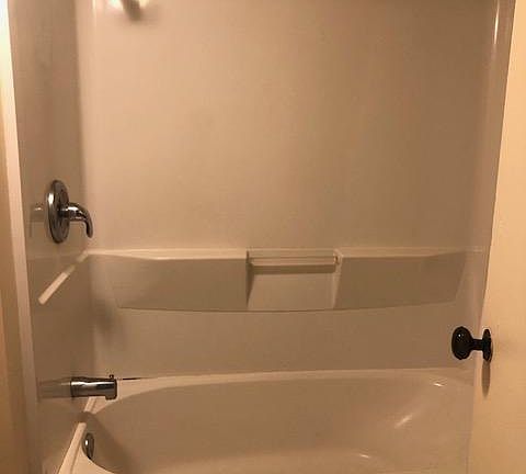 Newer shower over tub.