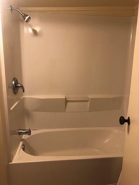 Newer shower over tub.