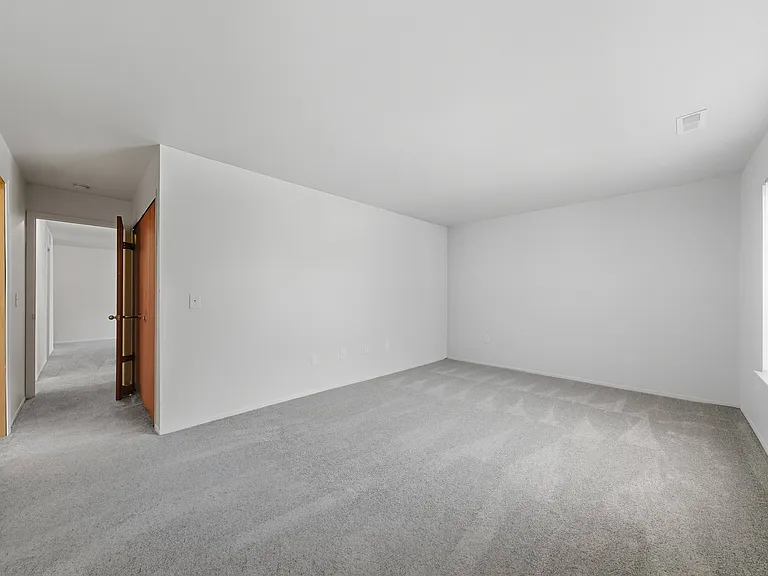 Comfortable Bedroom with natural light at Franklin River Apartments in Southfield, MI