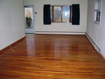 LIVING ROOM WITH GLEAMING H/W FLOORING!