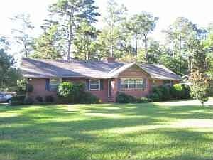 Front elevation, on large corner lot