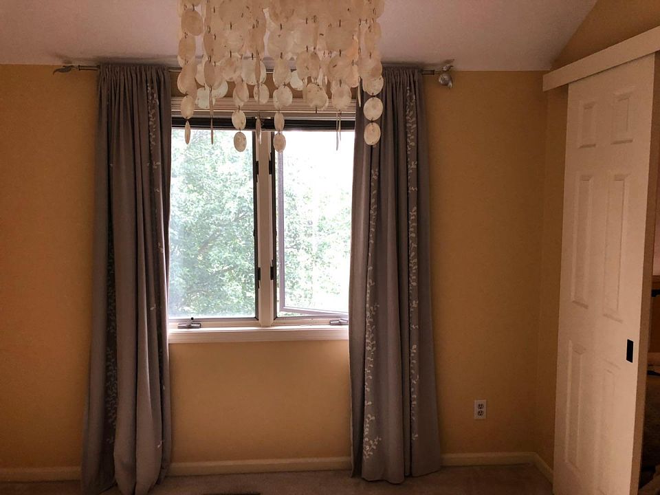 Master bedroom with a romantic shell chandelier and gorgeous view!
