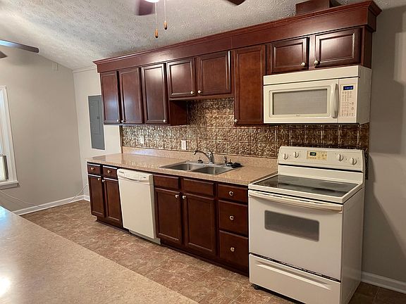 Kitchen includes microwave and dishwasher.