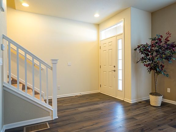 Elegant entry with warm wood