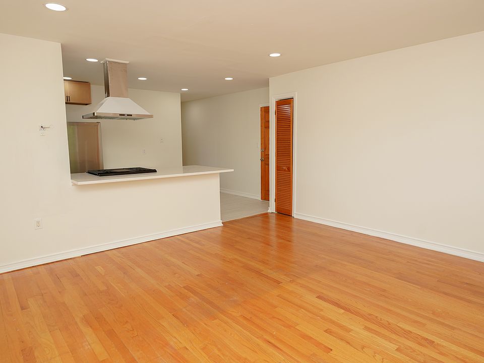 View of open concept space. Coat closet and Back entrance