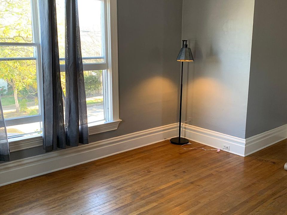 Spacious living room with many windows