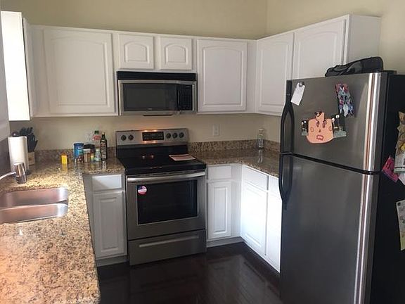Kitchen with stainless appliances and granite counter-top