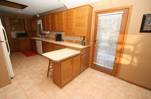 Breakfast area and an abundance of cabinetry.