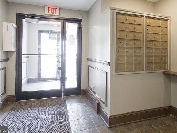 Facing from inside lobby looking at the main entrance. A newly installed key fob system will open the main door. This is a view of each units Personal Mail boxes and package pick up area as you enter the lobby.