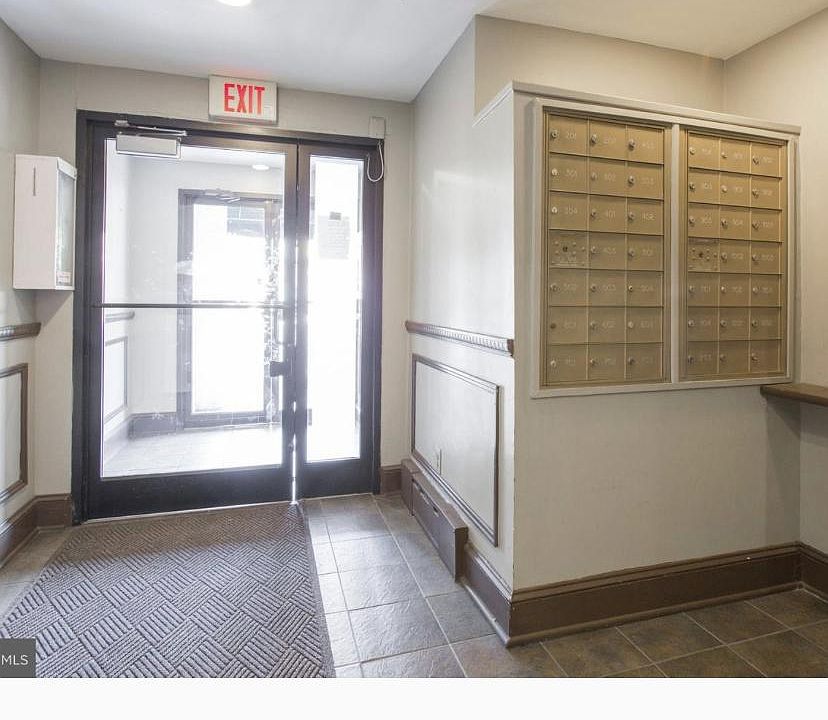 Facing from inside lobby looking at the main entrance. A newly installed key fob system will open the main door. This is a view of each units Personal Mail boxes and package pick up area as you enter the lobby.