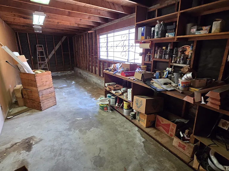 280 Square Large workshop/storage room at rear of garage (9'6" wide x 29'6" long)