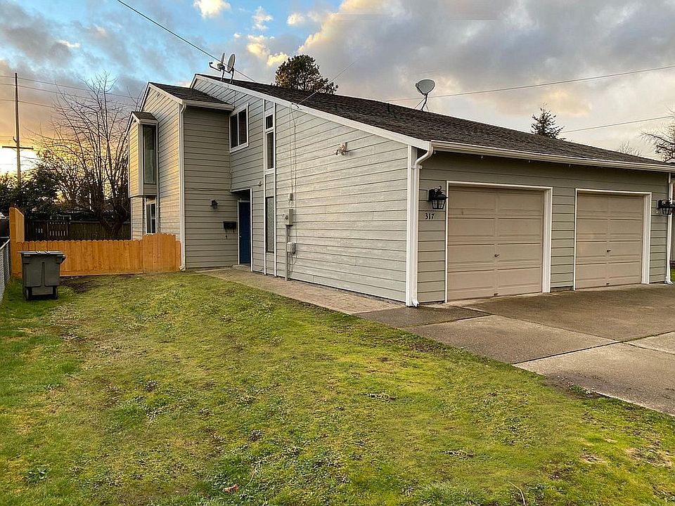 Charming duet-style home with each unit containing shy 1,300 square feet, 2+ bedrooms, and a single car garage.