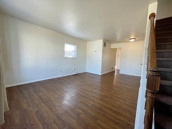 Front door view of open concept living and dining room area