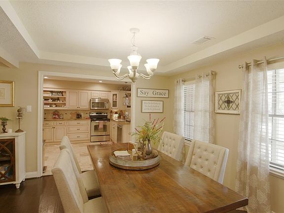 A lovely dining room opens to the kitchen and den. You won't believe the great flow in this home.