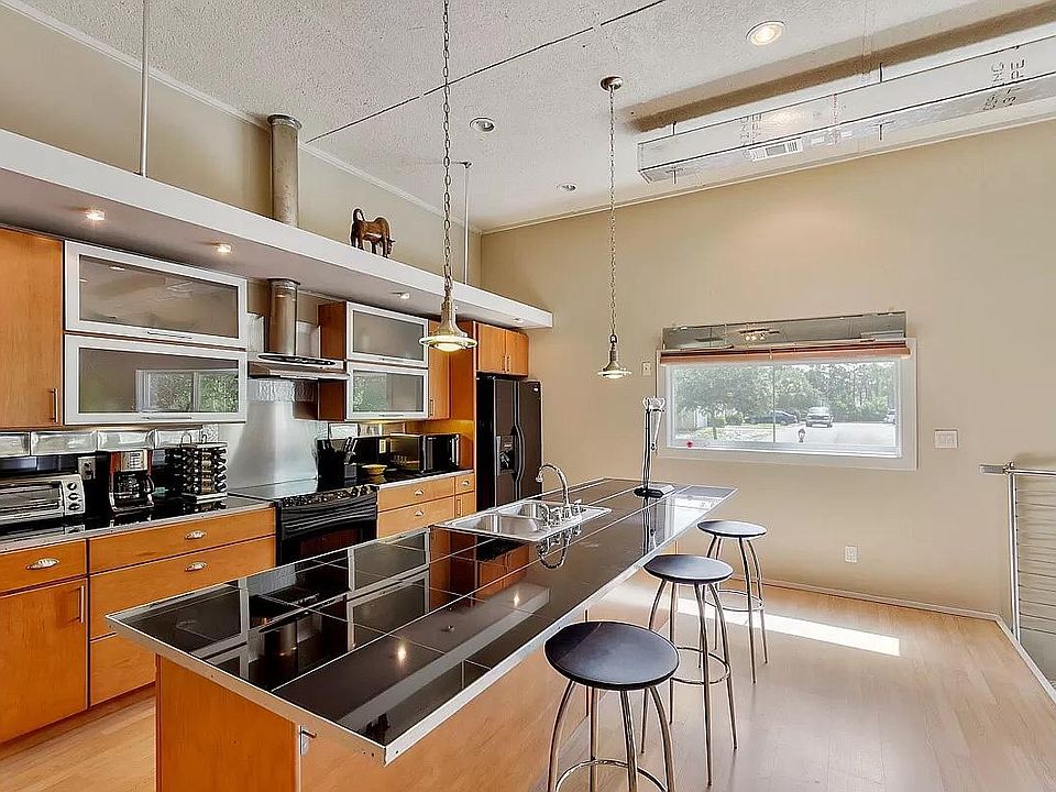 Modern, spacious kitchen with breakfast bar.