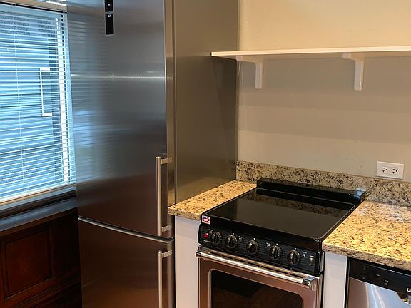 New stainless steel appliances and granite counters