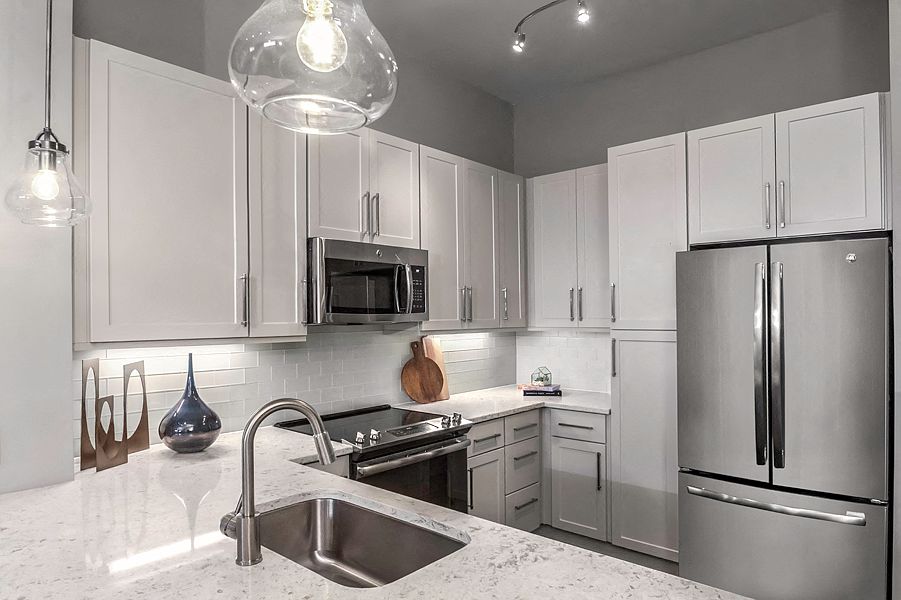 Premium quartz countertops with subway tile backsplash