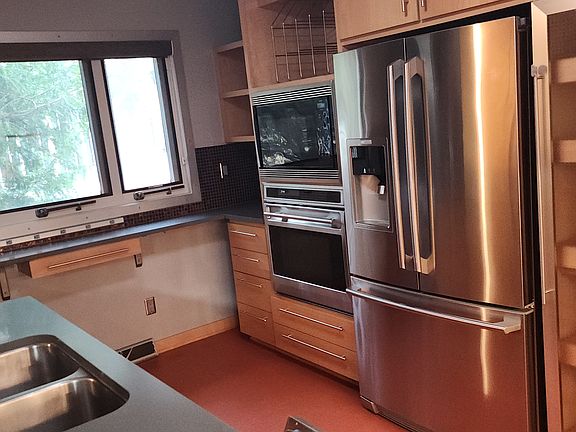 Kitchen deep sink, wolf appliances and large Electrolux Refrigerator Freezer