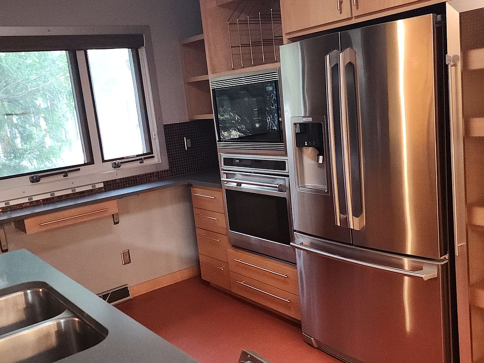 Kitchen deep sink, wolf appliances and large Electrolux Refrigerator Freezer