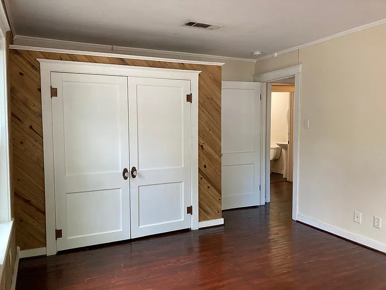 Bedroom #1 closet and view of door to living room