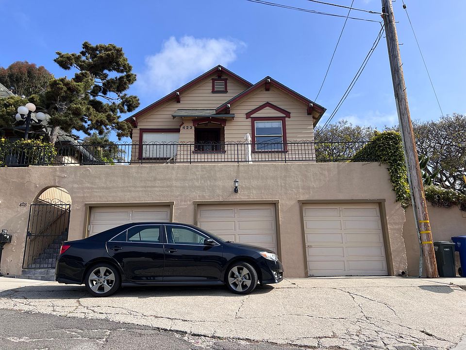 Front of house with single car garage on the right.