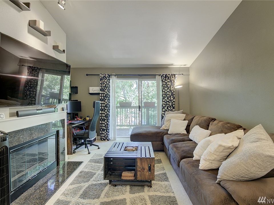 Great room with office nook, fireplace and patio access. 