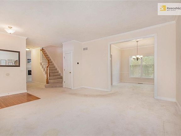 The formal living room adjoins a formal dining room.