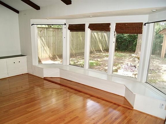 Spacious 20 x 20 Family Room with newly refinished hardwood floors, gas log fireplace and lots of natural light.
