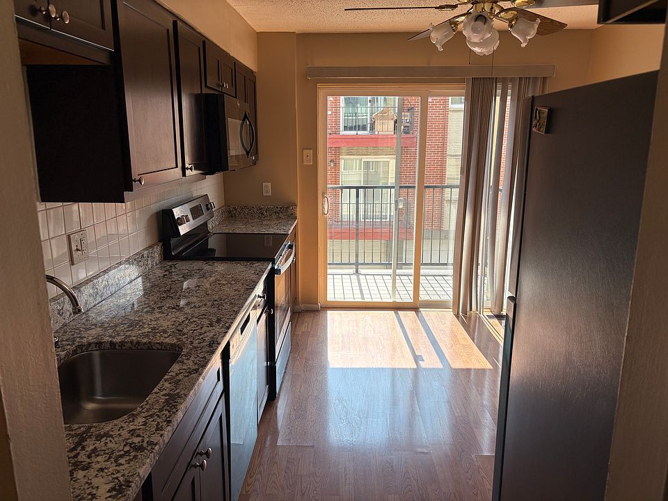Kitchen with Stainless Steel and Black Appliances and New Granite Countertop