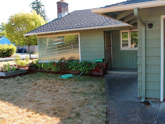 Flower beds & raised gardens in front yard.
