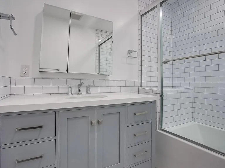 Brand new hall bathroom with large soaking bathtub.