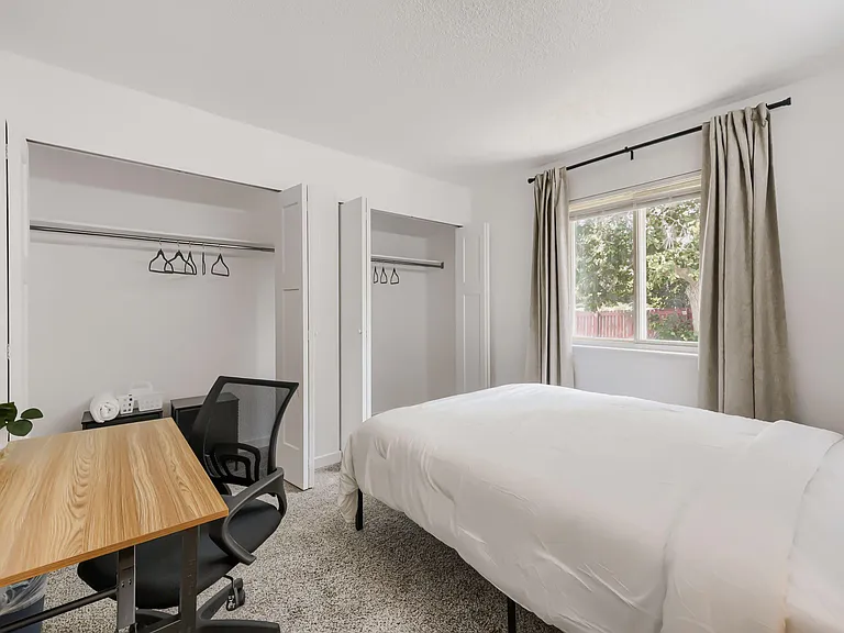 Room includes large reach-in closet with set of drawers and hangers. Plenty of extra storage space!