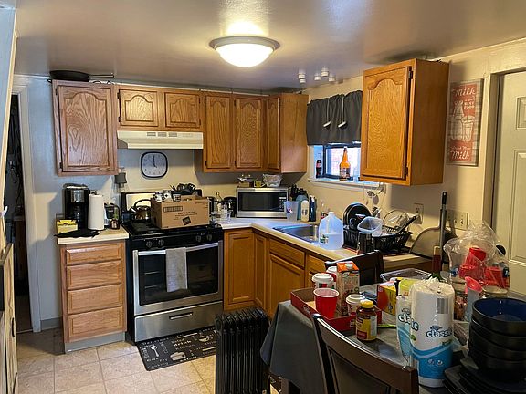 Kitchen with Oak Cabinets and Stainless Steel Gas Stove