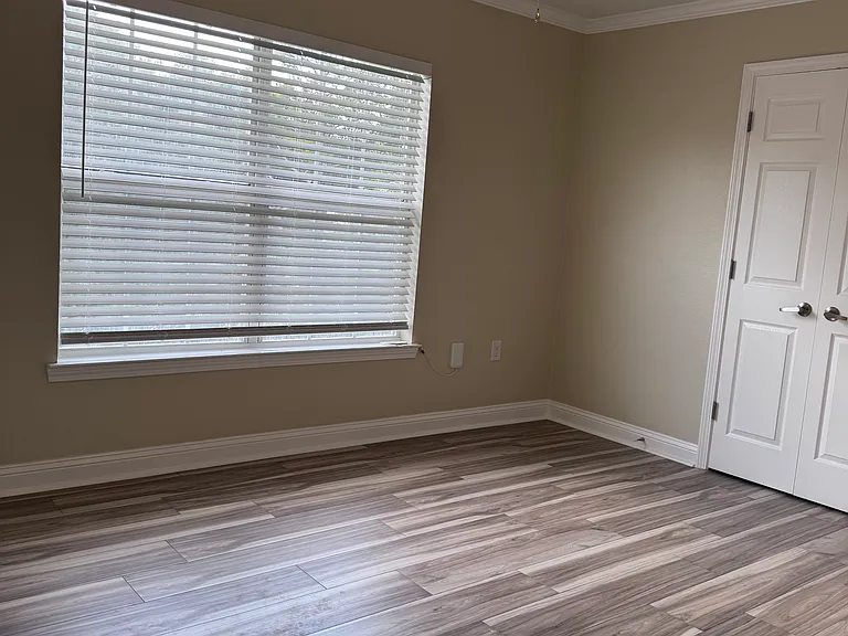 Master bedroom with doors to closet.