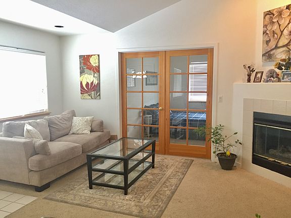 open living room with vaulted ceilings and lots of light