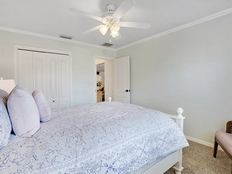 2nd bedroom, very large room with large closet and chair for sitting or reading.
