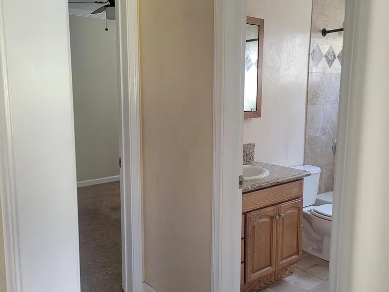 hallway looking into bathroom