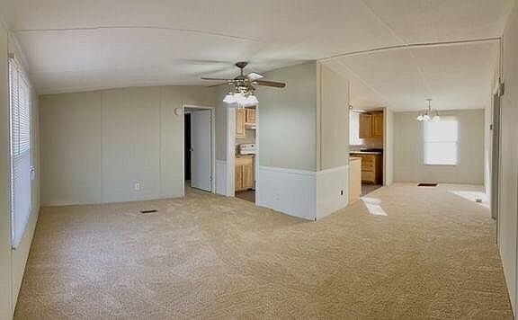 View of living room and dining room from front door