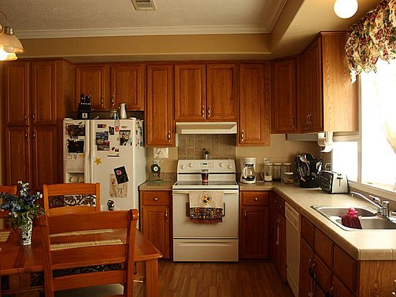   Large kitchen with rich cabinetry