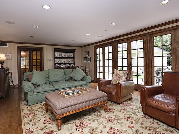 Fabulous family room with window wall overlooking big back yard.